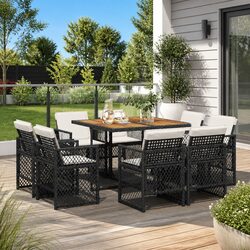 9 Piece Outdoor Dining Set: Black Cushions and Furniture